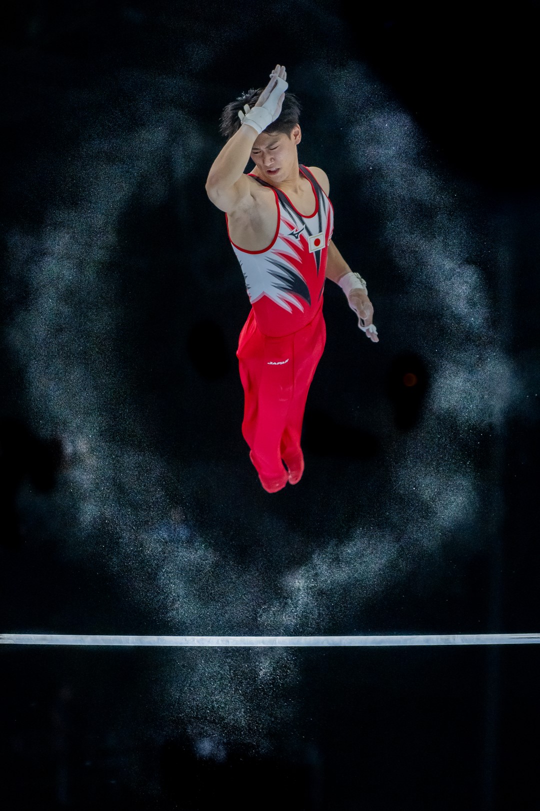 The winning photograph by Eric T'Kindt for his stunning shot of Japanese gymnast Daiki Hashimoto. Source: World Sports Photography Awards.